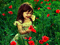 دختر بچه زیبا در میان گلها