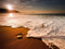 منظره امواج کنار ساحل و طلوع خورشید