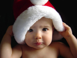عکس بچه با کلاه بابا نوئل